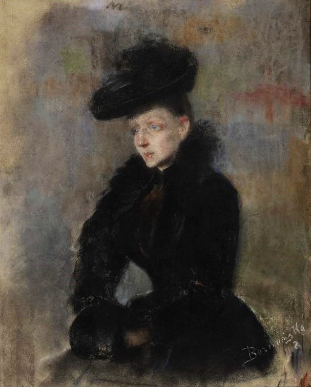 黒い帽子をかぶった女性。